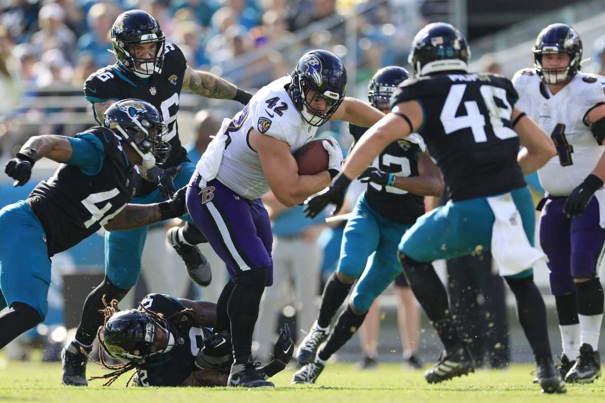 Jacksonville Jaguars safety Andre Cisco (5) breaks up a pass intended for  Baltimore Ravens tight end Mark Andrews (89) during the second half of an  NFL football game, Sunday, Nov. 27, 2022