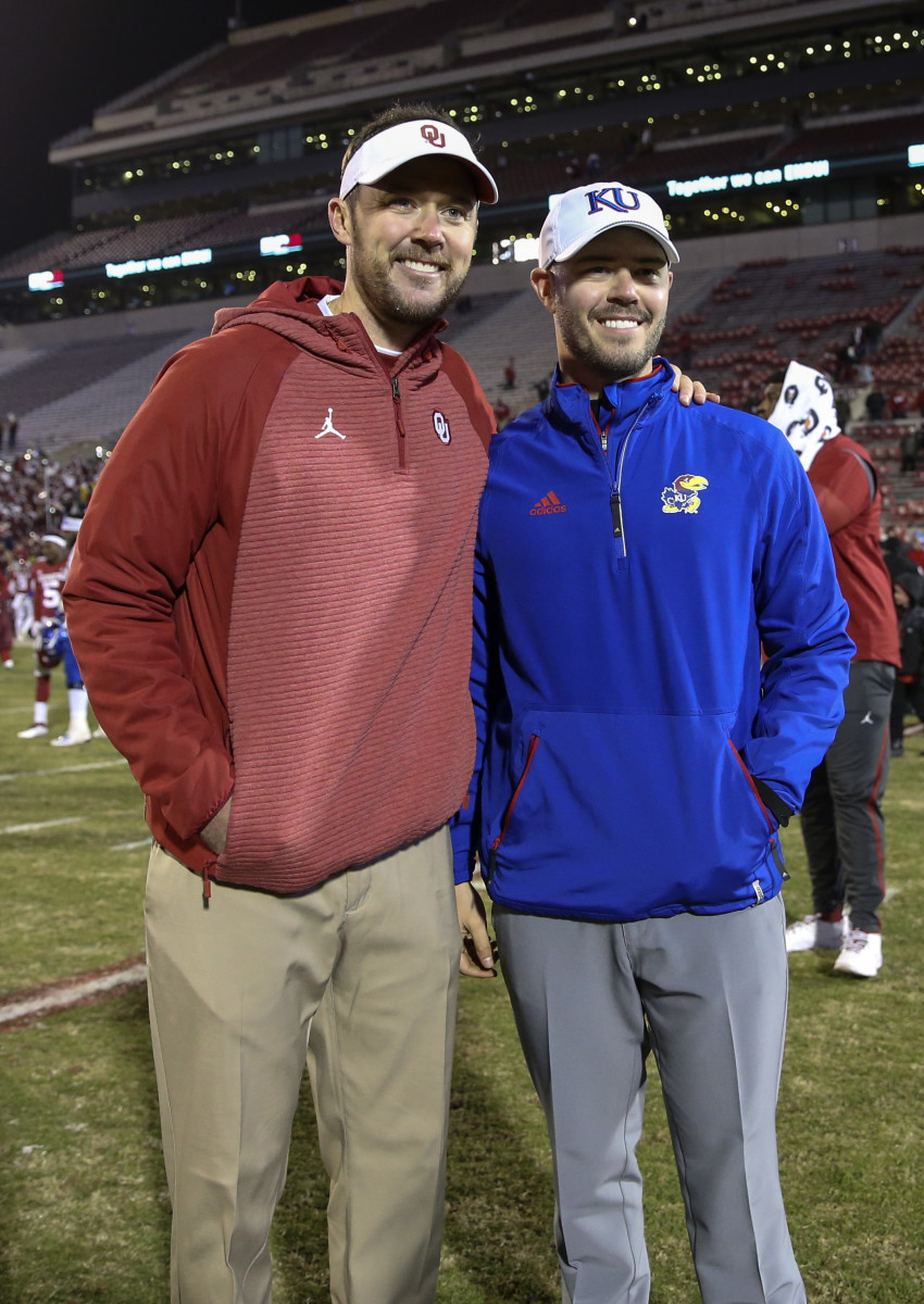 Garrett Riley (right) poses for a photo with Lincoln Riley (left) during his time as an offensive analyst at Kansas.