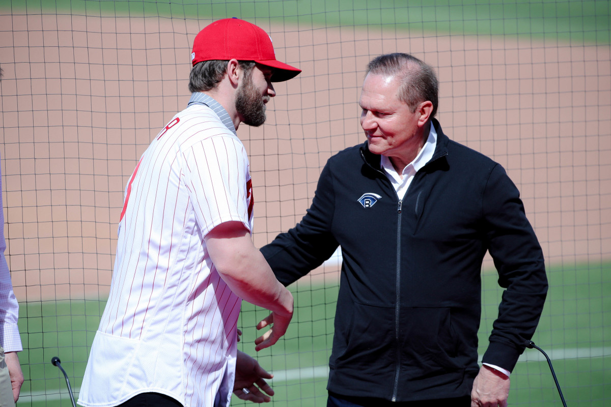 Philadelphia Phillies right fielder Bryce Harper turns to face agent Scott Boras