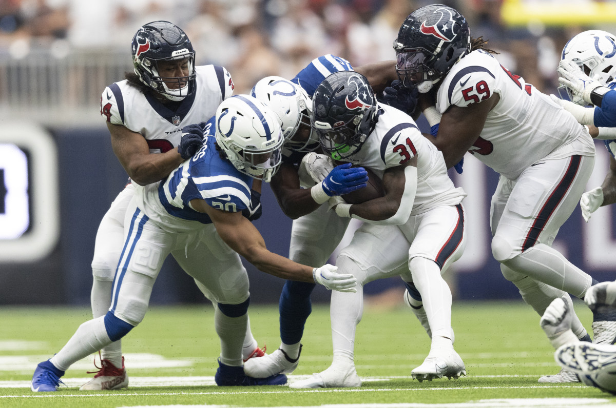 Sep 11, 2022; Houston, Texas, USA; Houston Texans running back Dameon Pierce (31) is tackled by Indianapolis Colts safety Nick Cross (20) in the fourth quarter at NRG Stadium.