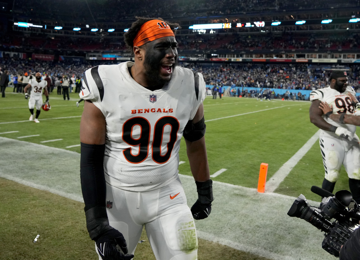 Jan 22, 2022; Nashville, Tennessee, USA; Cincinnati Bengals defensive end Khalid Kareem (90) celebrates after the Bengals defeated the Tennessee Titans 19-16 during the AFC Divisional playoff football game at Nissan Stadium.