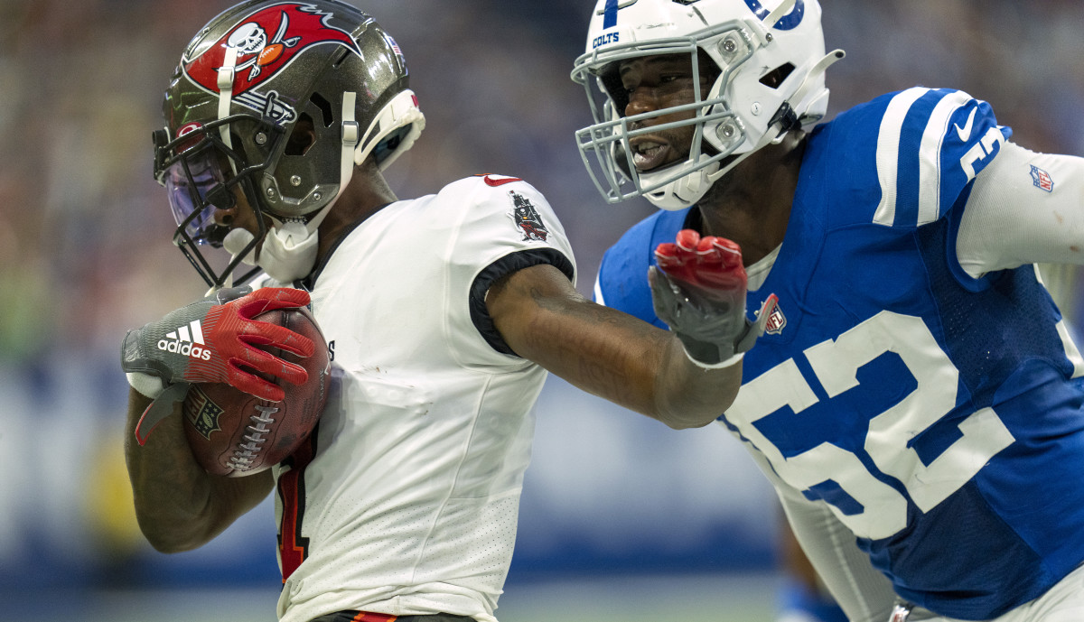 Aug 27, 2022; Indianapolis, Indiana, USA; Tampa Bay Buccaneers wide receiver Jaelon Darden (1) is chased out of bounds by Indianapolis Colts defensive end Ben Banogu (52) during a preseason game at Lucas Oil Stadium.