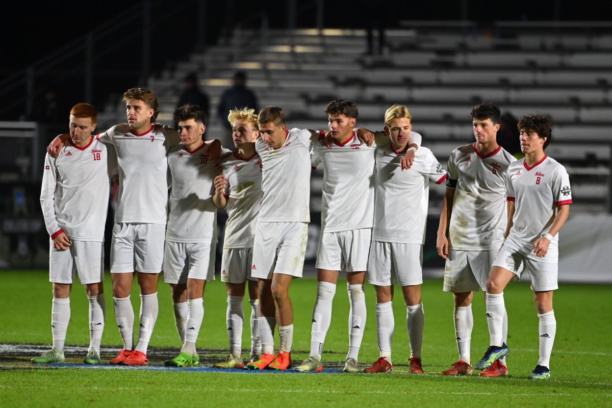 Indiana players line up to watch the penalty kick shootout during Monday's title game.  (Bob Donnan-USA TODAY Sports)