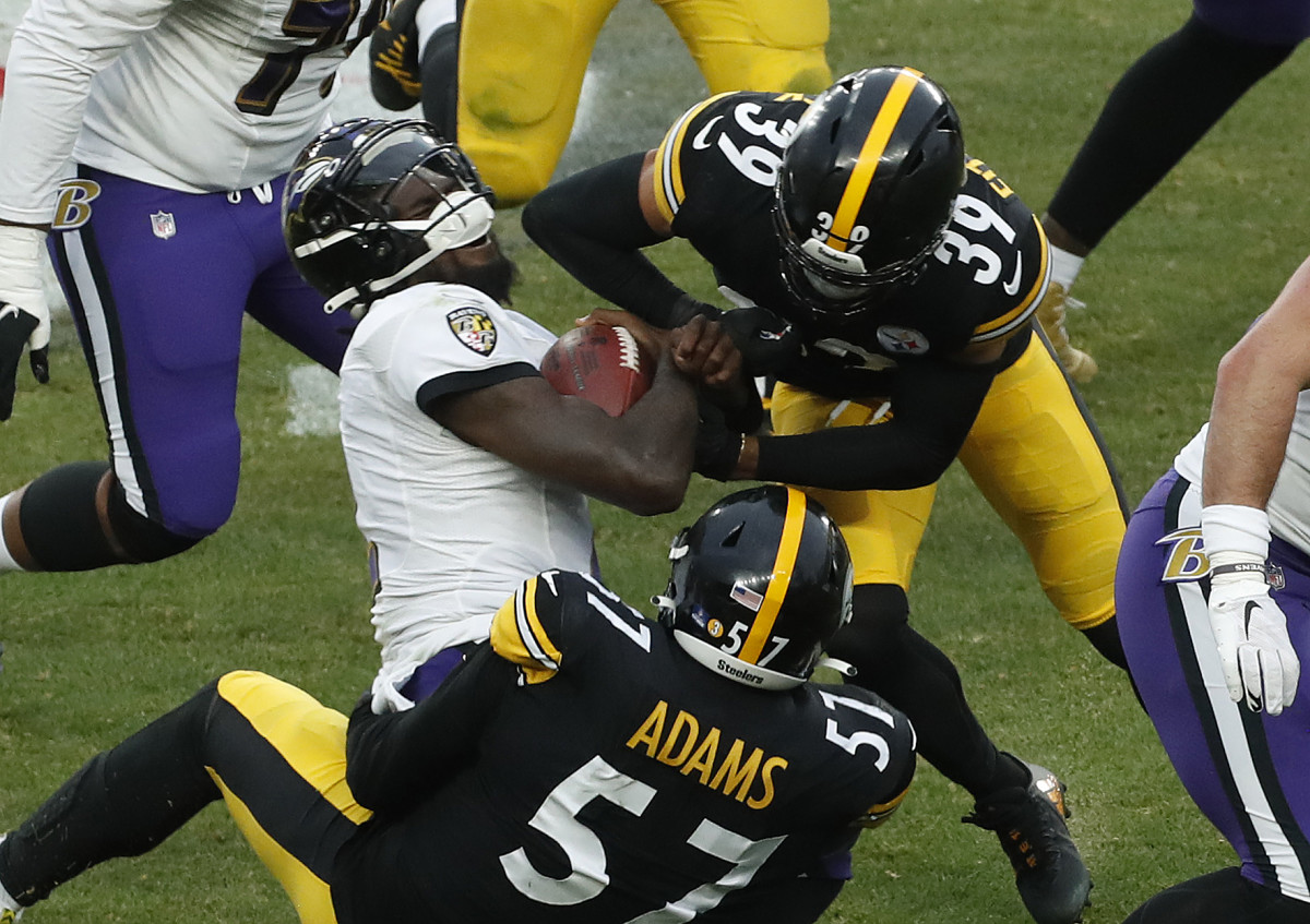 Huntley Rocks Comfortable Footwear After Ravens Practice