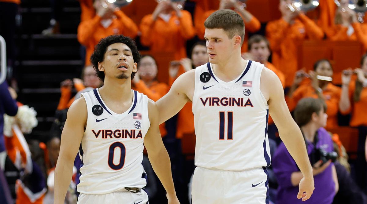 Dec 6, 2022; Charlottesville, Virginia, USA; Virginia Cavaliers guard Kihei Clark (0) reacts with Cavaliers guard Isaac McKneely (11) after their game against the James Madison Dukes at John Paul Jones Arena.