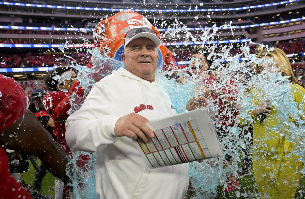 Jeff Tedford takes a victory bath. Photo by Jayne Kamin-Oncea, USA TODAY Sports