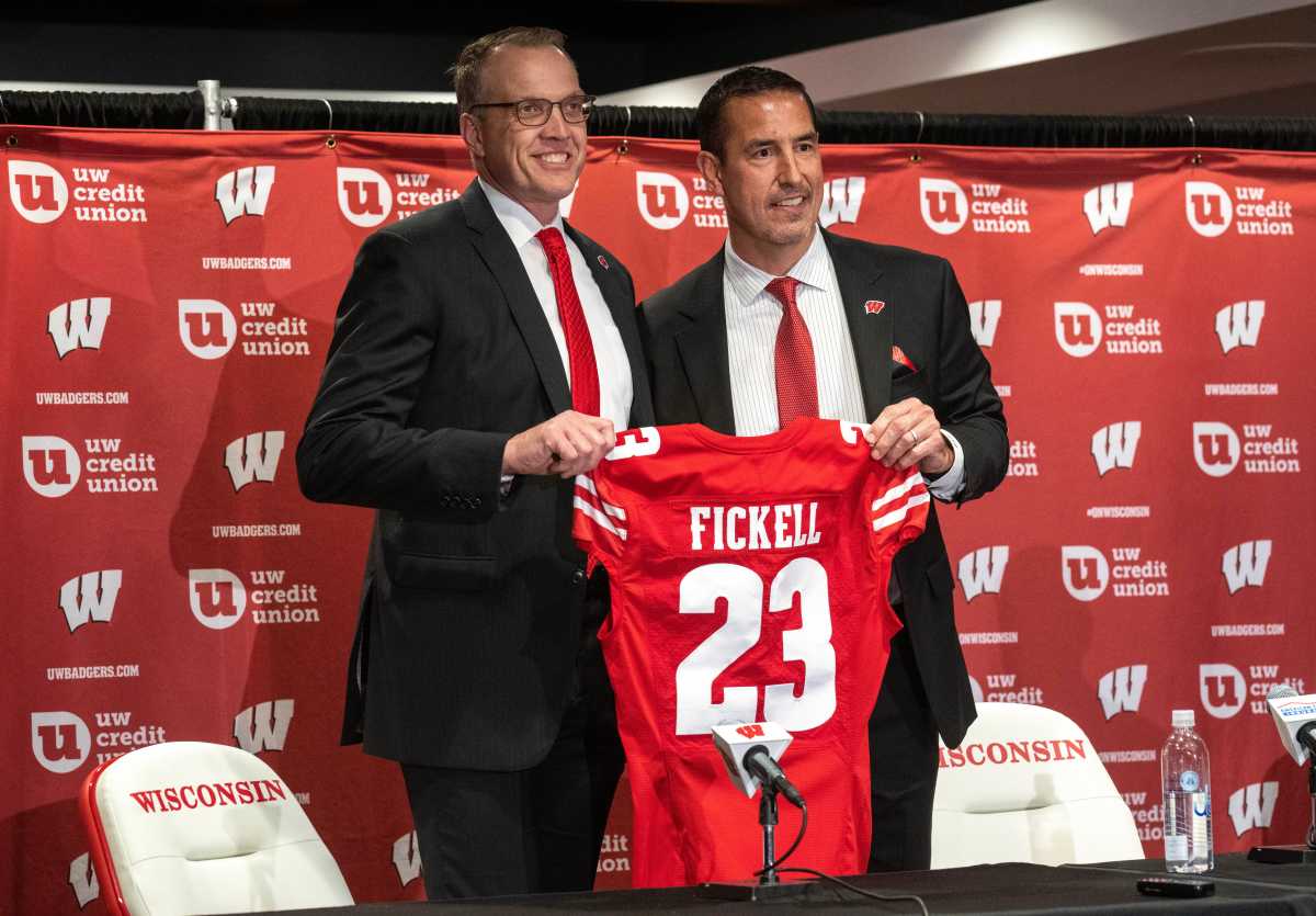 New Wisconsin head football coach Luke Fickell, right, poses with athletic director Chris McIntosh at a news conference introducing Fickell on Monday, November 28, 2022 at Camp Randall Stadium in Madison, Wis. He was previously head coach for six seasons at Cincinnati.