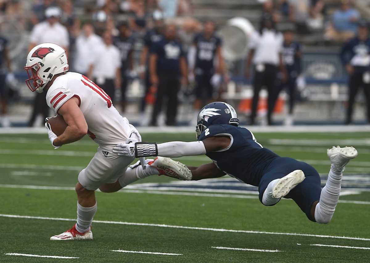 Nevada's Isaiah Essissima tries to tackle Incarnate Word's Taylor Grimes at Mackay Stadium in Reno on Sept. 10, 2022. Syndication Reno Gazette Journal