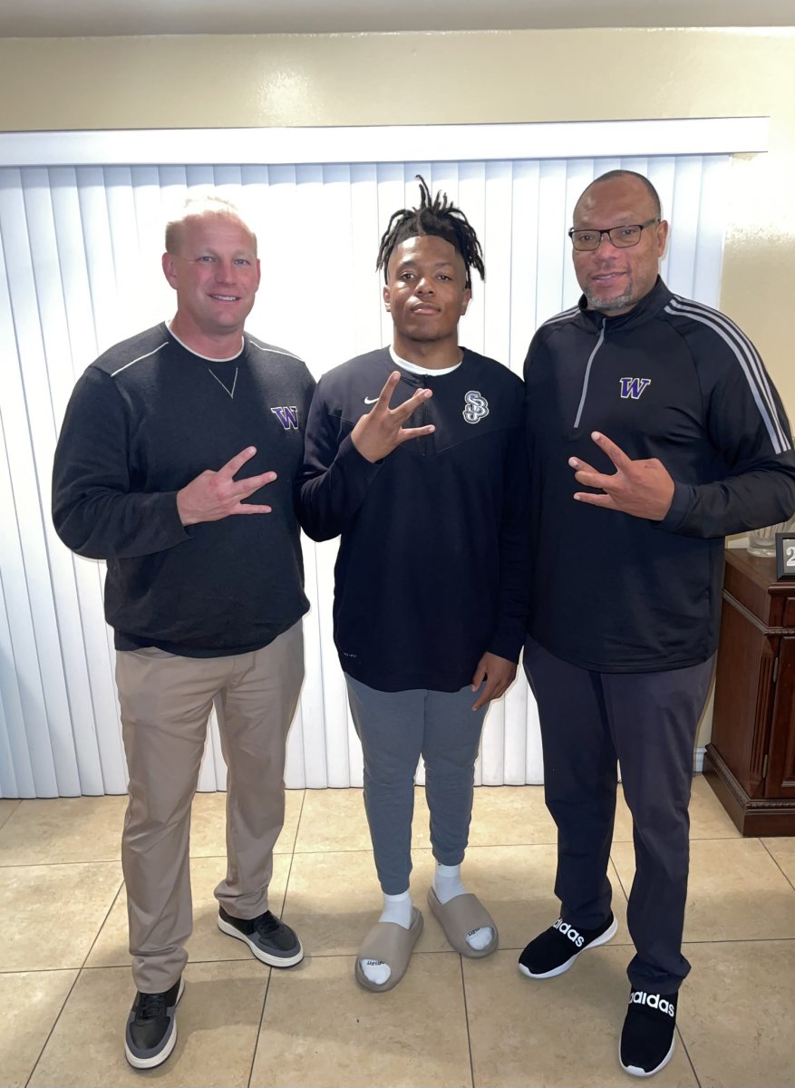 UW coach Kalen DeBoer and defensive coordinator William Inge spend a home visit with linebacker Deven Bryant.