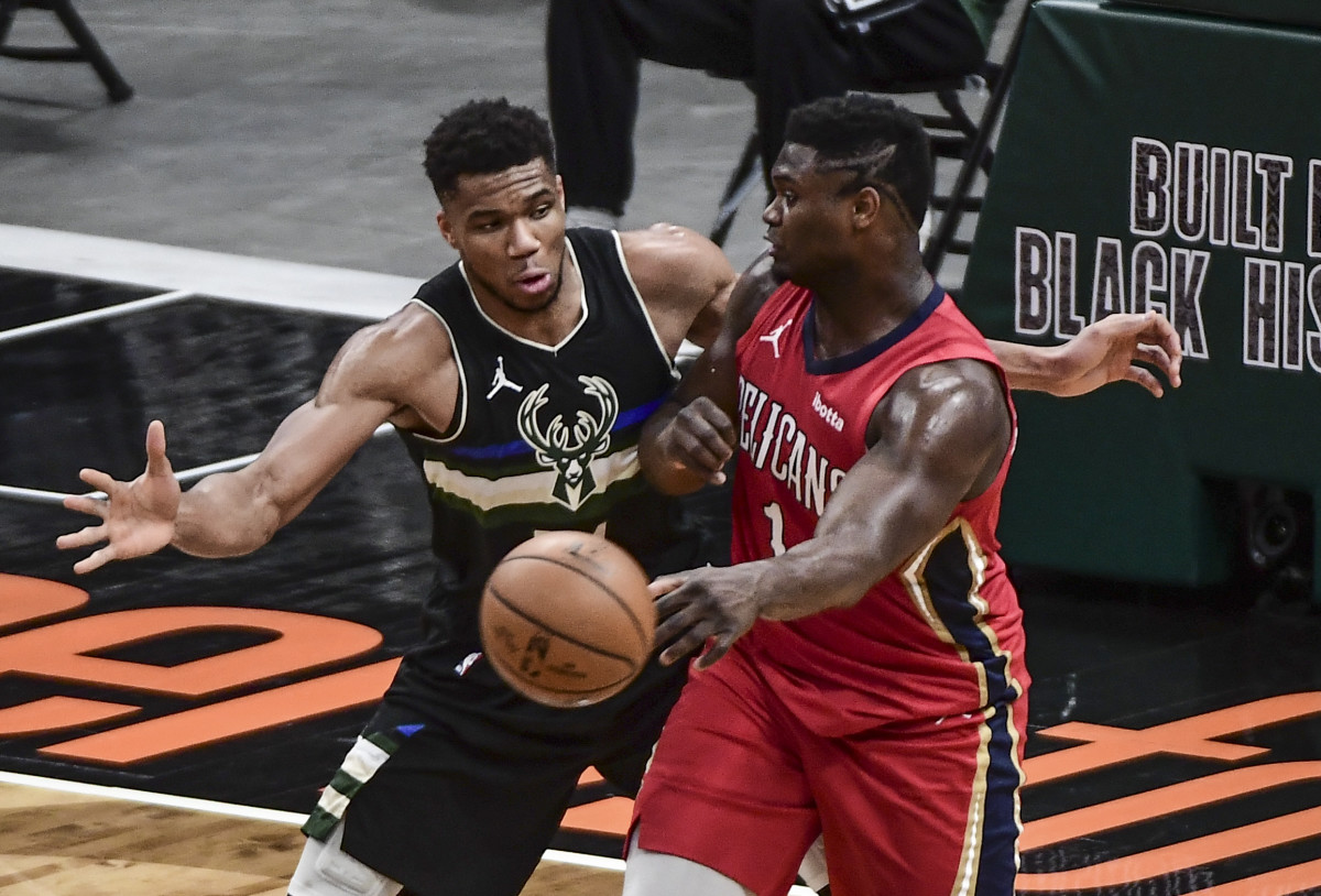 Milwaukee Bucks forward Giannis Antetokounmpo (34) pressures New Orleans Pelicans forward Zion Williamson (1)