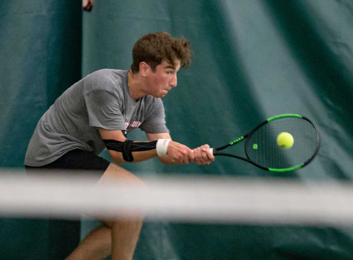 Auburn's Drew Licari hits the ball against Hononegah in a doubles match on Saturday, May 21, 2022, at Boylan High School in Rockford. RFD0523 Rockford Sectional Tennis