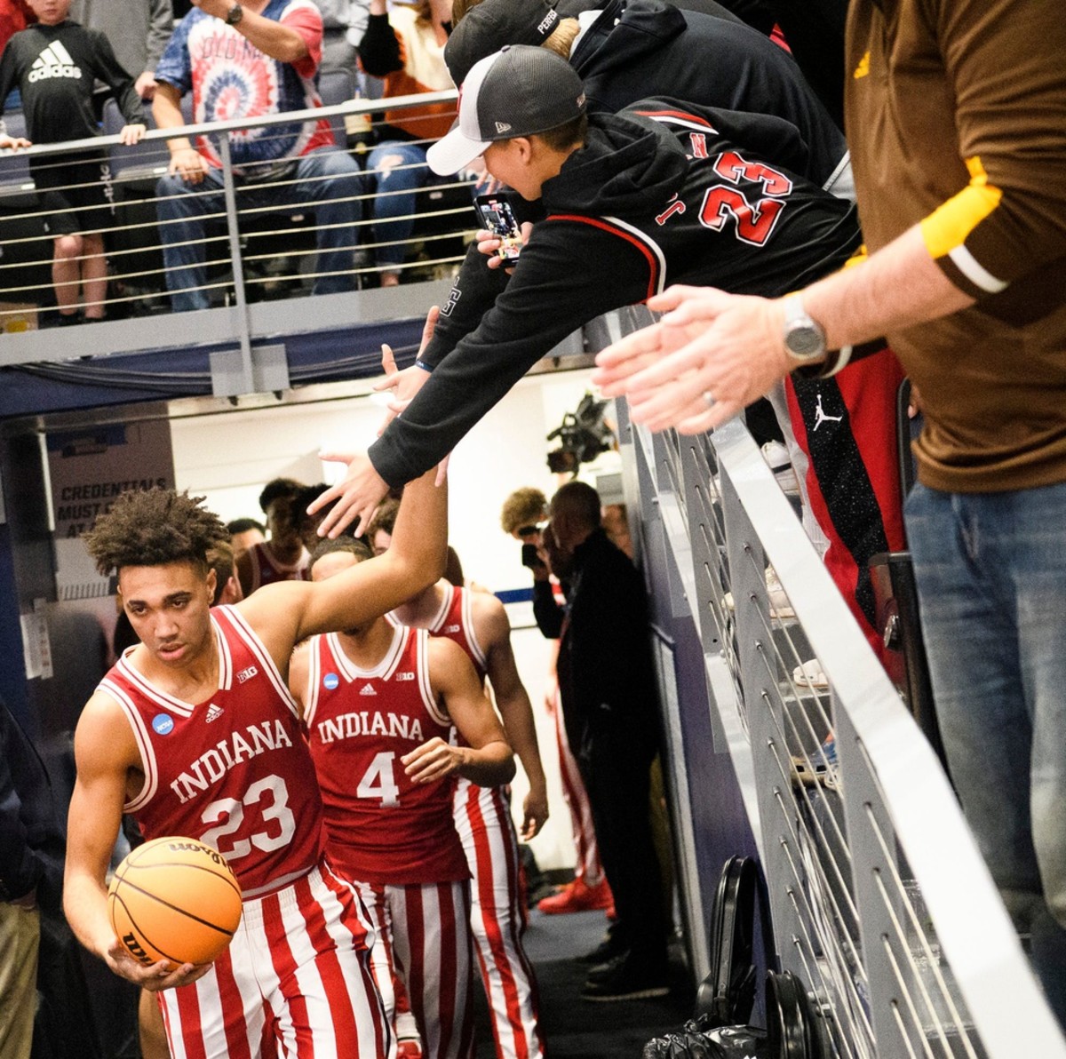 A determined Trayce Jackson-Davis (23) high-fives fans as he leads Indiana onto the floor at the University of Dayton Arena for their First Four NCAA Tournament game. (USA TODAY Sports)