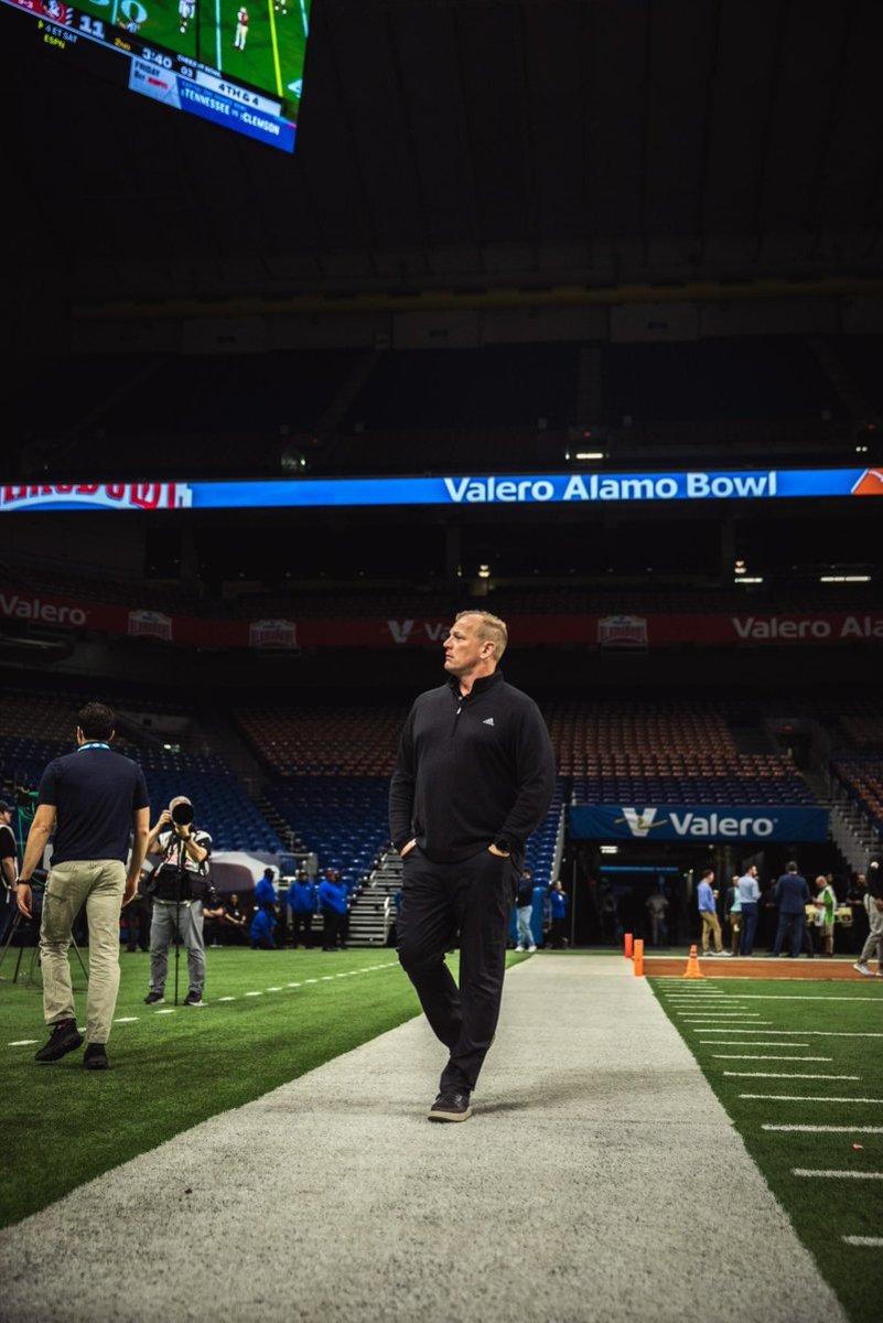 Kalen DeBoer grabs a few moments alone to survey the scene at the Alamo Bowl.