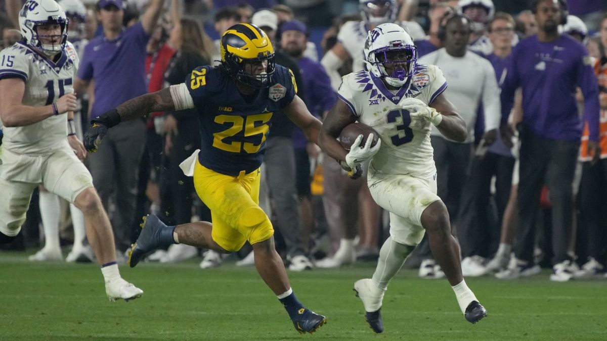 TCU running back Emari Demercado (3) breaks free from Michigan linebacker Junior Colson (25) during the second half of the Fiesta Bowl NCAA college football semifinal playoff game, Saturday, Dec. 31, 2022, in Glendale, Ariz.