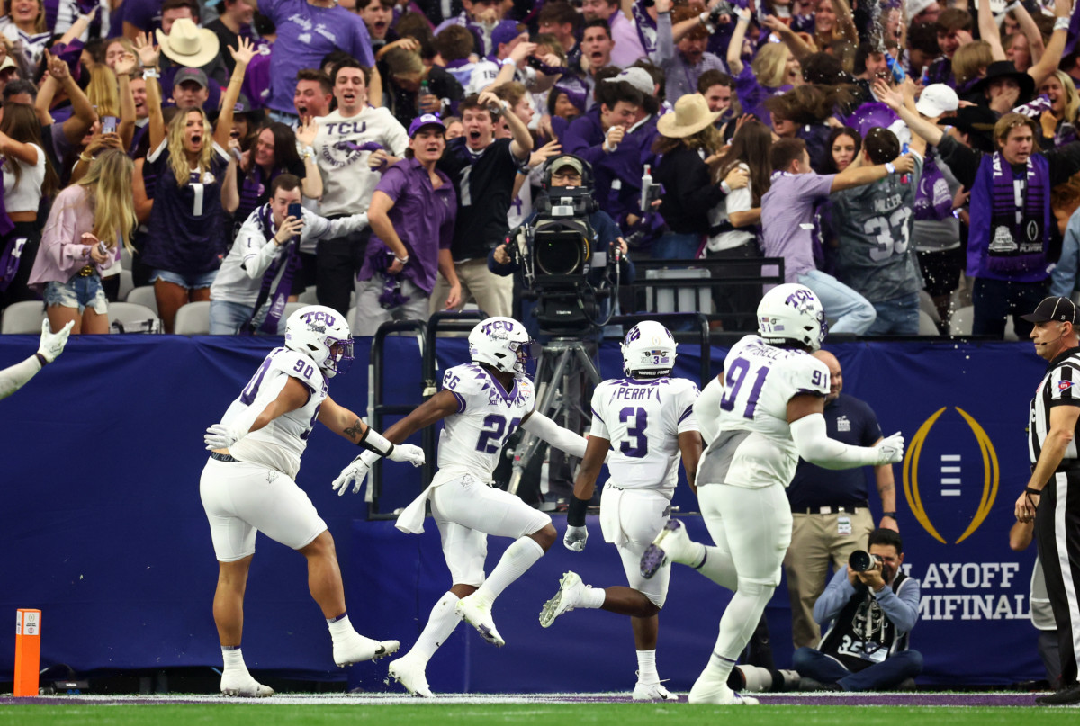 Bud Clark celebrates his massive pick-six against Michigan (Mark J. Rebilas-USA Today Sports)