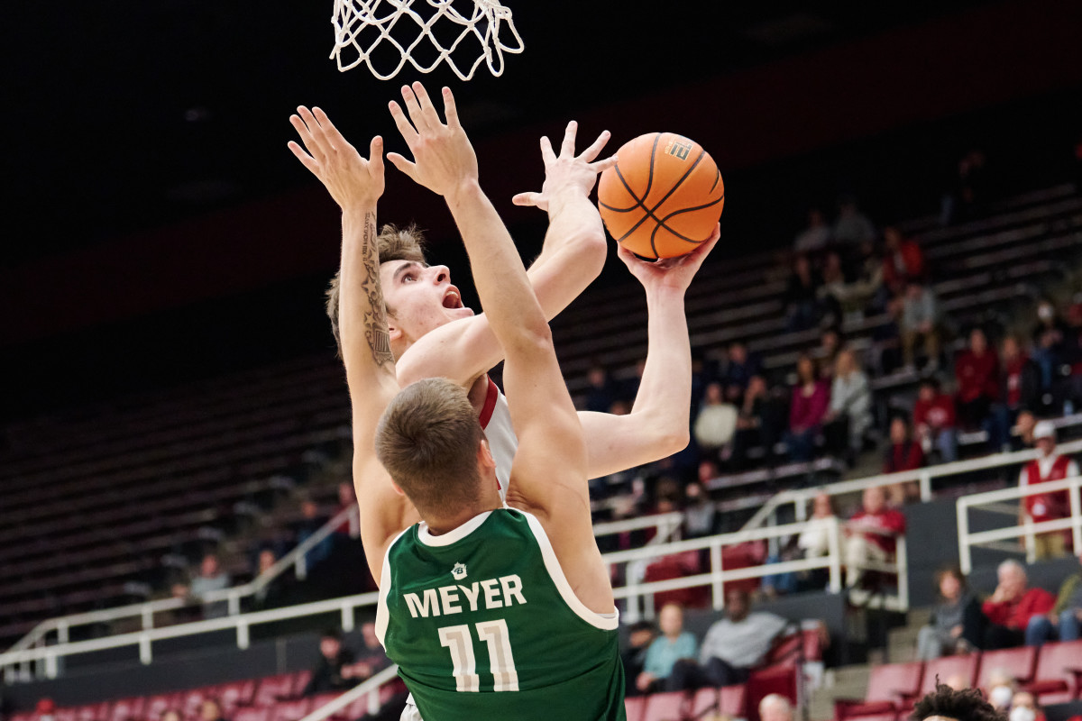 Stanford Cardinal forward Maxime Raynaud (42) shoots the ball against Green Bay Phoenix forward Cade Meyer (11) during the second half at Maples Pavilion.