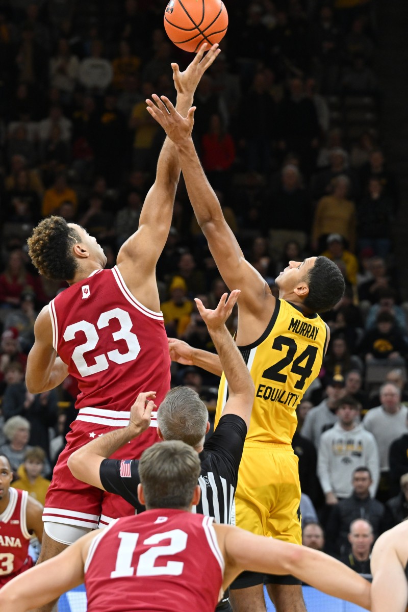 Indiana Hoosiers forward Trayce Jackson-Davis (23) and Iowa Hawkeyes forward Kris Murray (24) compete for the opening tipoff during the first half at Carver-Hawkeye Arena.