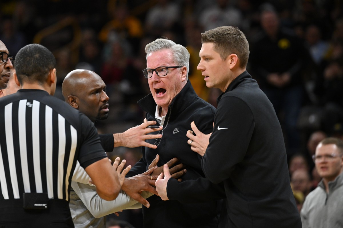 Iowa Hawkeyes head coach Fran McCaffery (center) reacts with an official after being called for a technical foul during the first half against the Indiana Hoosiers at Carver-Hawkeye Arena.