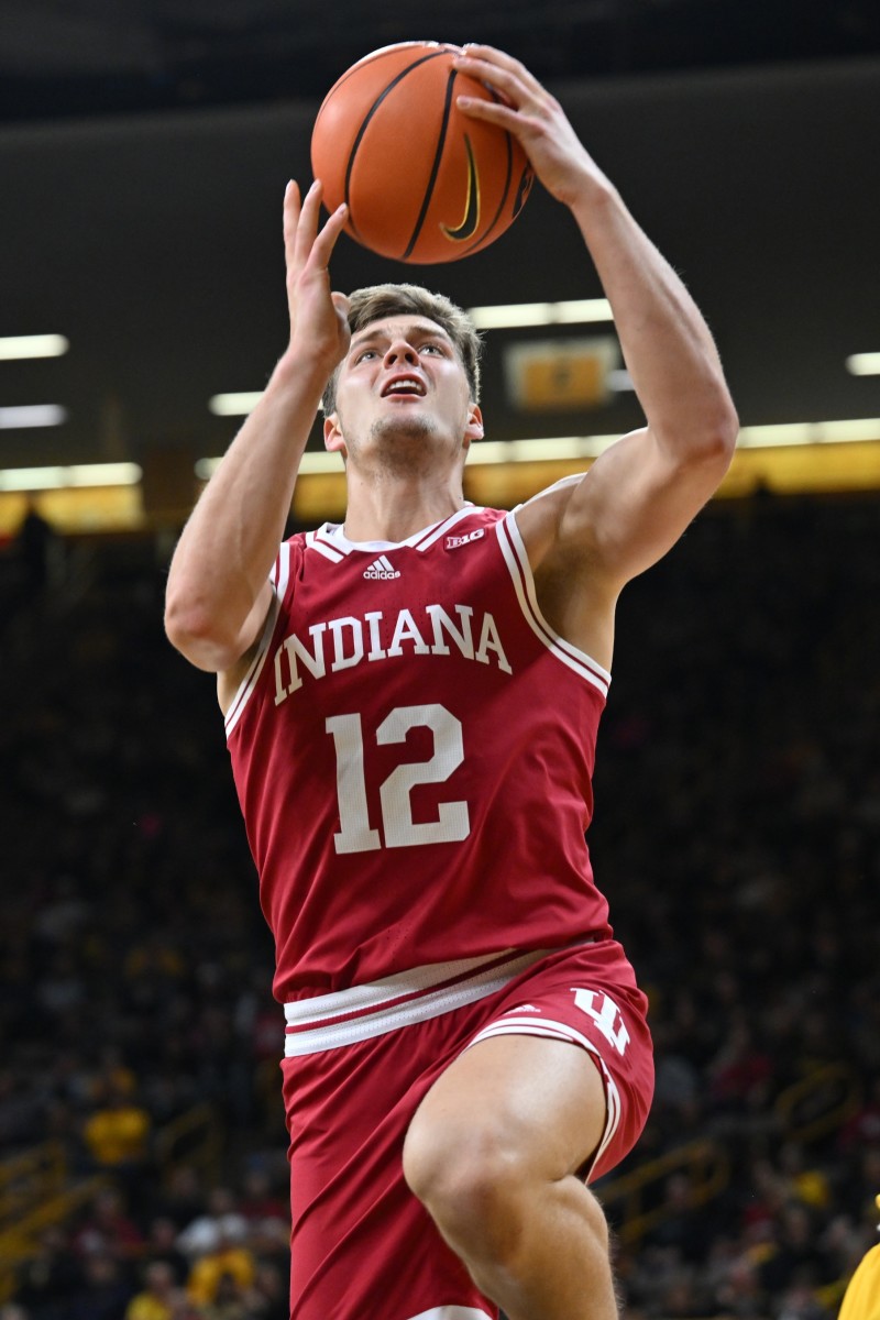 Indiana Hoosiers forward Miller Kopp (12) goes to the basket against the Iowa Hawkeyes during the first half at Carver-Hawkeye Arena.