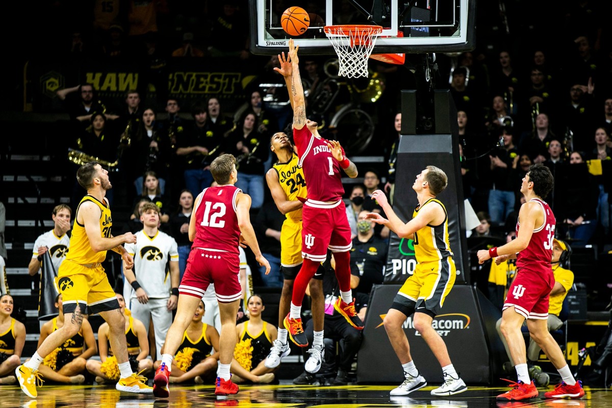 Indiana guard Jalen Hood-Schifino (1) makes a basket as Iowa forward Kris Murray (24) defends during a NCAA Big Ten Conference men's basketball game.