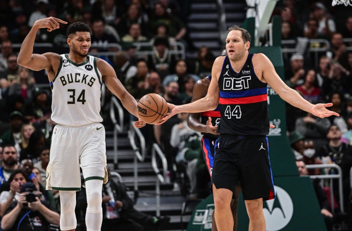 Detroit Pistons forward Bojan Bogdanovic (44) reacts after being called for an offensive foul as Milwaukee Bucks forward Giannis Antetokounmpo (34)