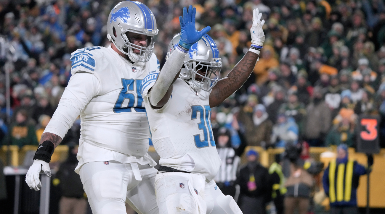 Detroit Lions running back Jamaal Williams (30) jokes with fans as he warms  up prior to an NFL football game against the Green Bay Packers, Monday,  Sept. 20, 2021, in Green Bay