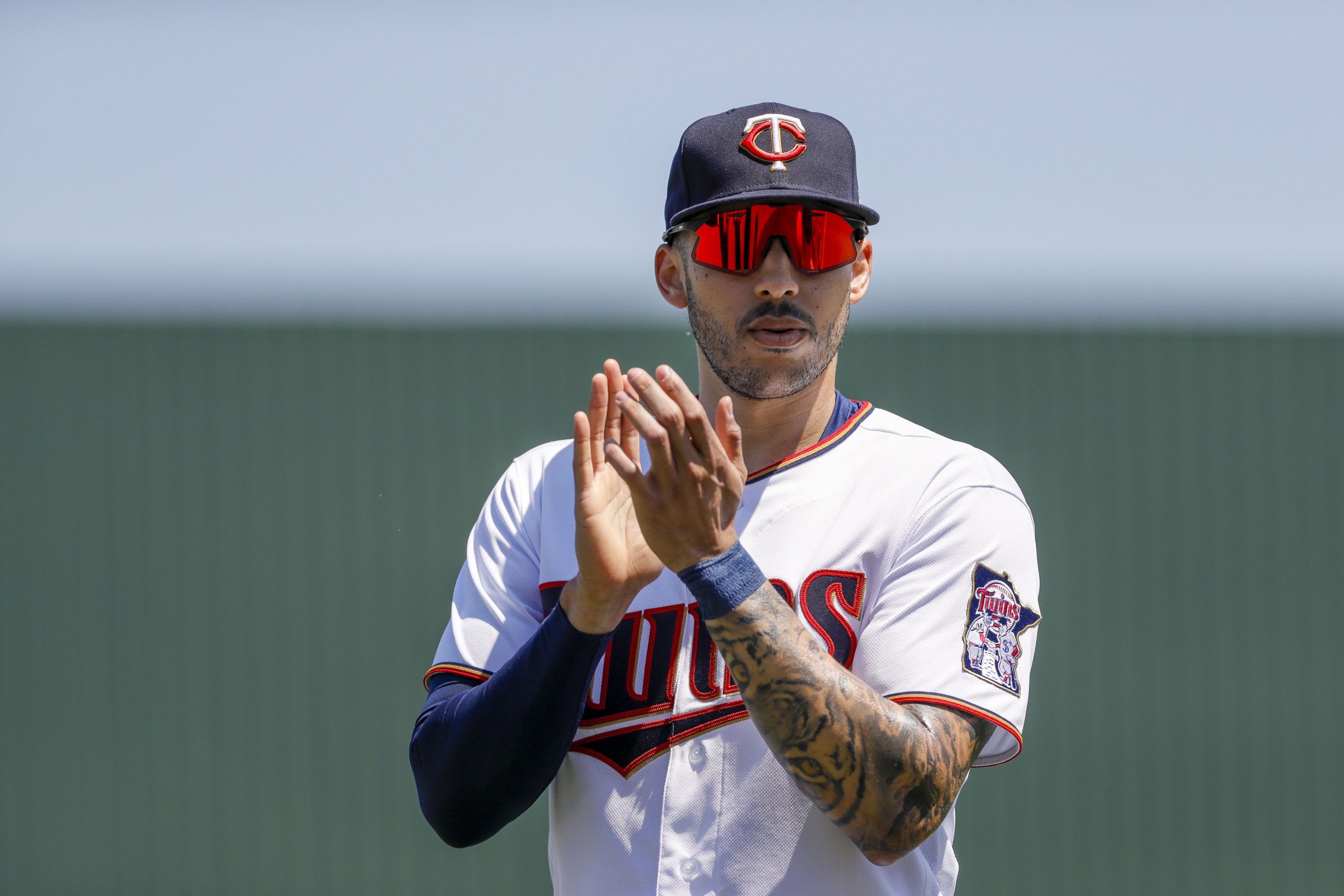 Twins are posting photos of Carlos Correa in Minnesota gear, and