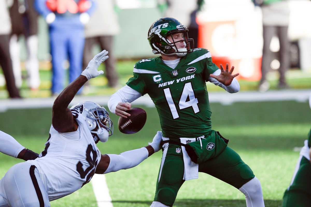 Las Vegas Raiders defensive end Clelin Ferrell (96) reaches up to swipe the ball out of New York Jets quarterback Sam Darnold's (14) hand in the first half of a game at MetLife Stadium on Sunday, Dec. 6, 2020, in East Rutherford. Nyj Vs Lv