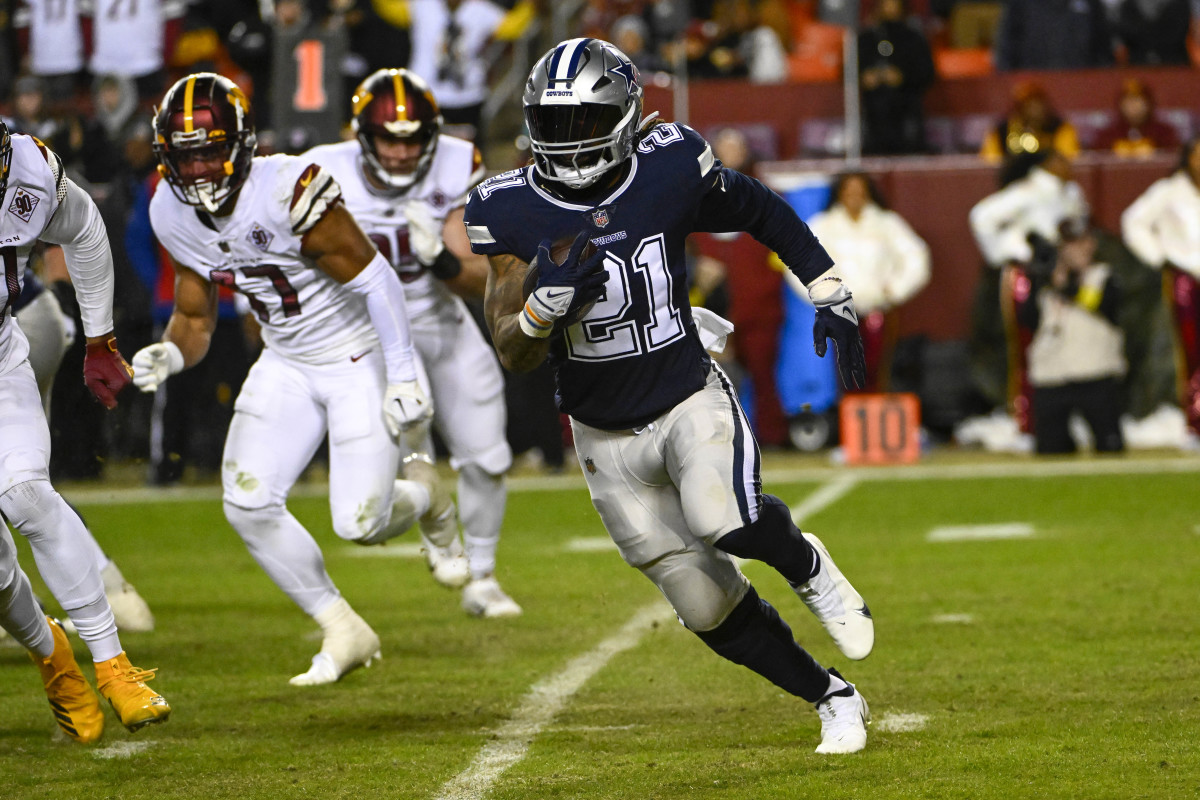 Jan 8, 2023; Landover, Maryland, USA; Dallas Cowboys running back Ezekiel Elliott (21) carries the ball against the Washington Commanders during the second half at FedExField.