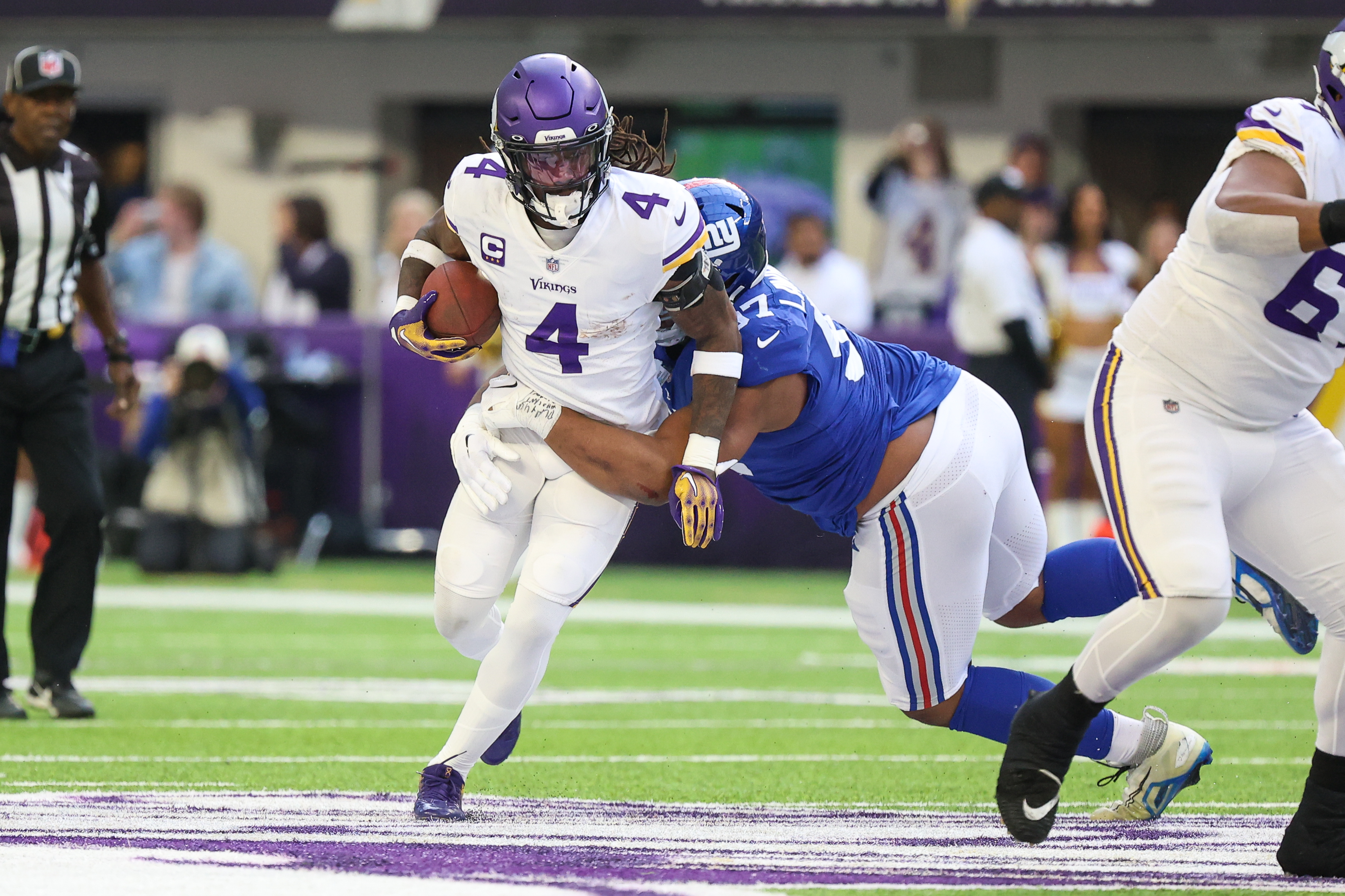 Minnesota Vikings running back Dalvin Cook walks on the field before an NFL  wild card playoff football game against the New York Giants, Sunday, Jan.  15, 2023, in Minneapolis. (AP Photo/Charlie Neibergall