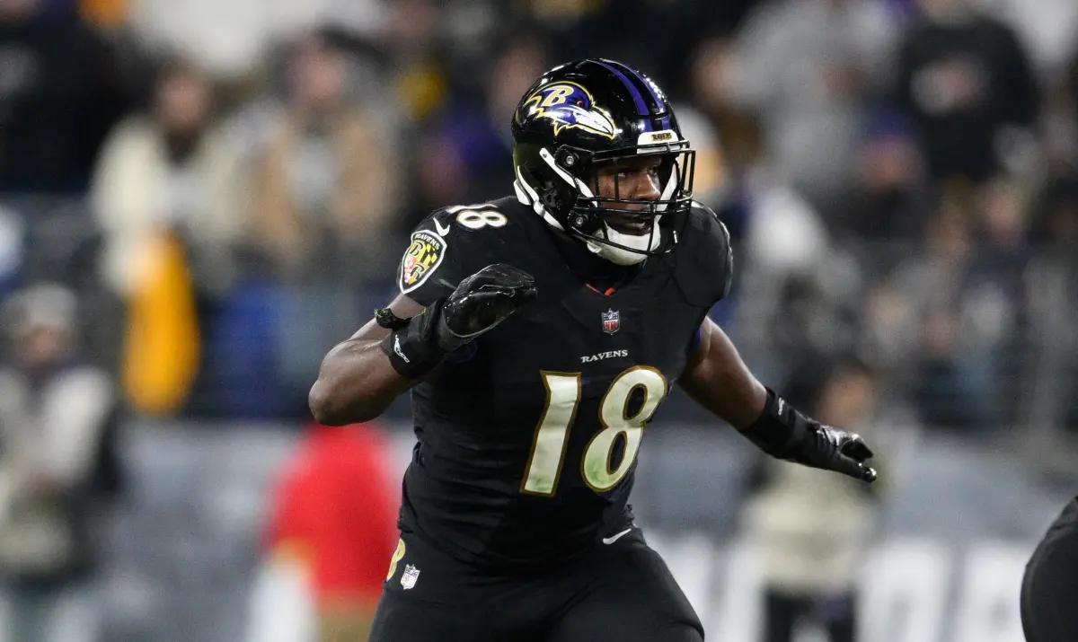 Baltimore Ravens linebacker Roquan Smith (18) runs out of the tunnel during  player introductions before an NFL football game against the Denver  Broncos, Sunday, Dec. 4, 2022, in Baltimore. (AP Photo/Terrance Williams