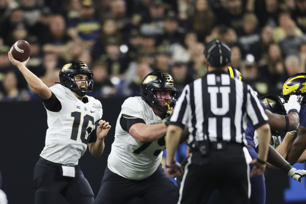 Indianapolis, Indiana, USA; Purdue Boilermakers quarterback Aidan O'Connell (16) passes during the first half of the Big Ten Championship against the Michigan Wolverines at Lucas Oil Stadium.