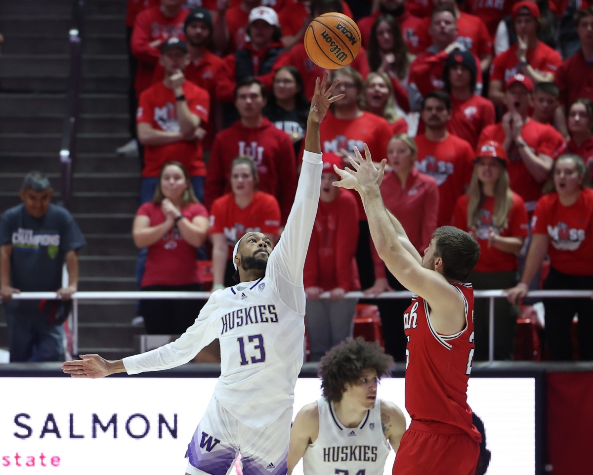 Langston Wilson of the UW tries to block a Utah shot.