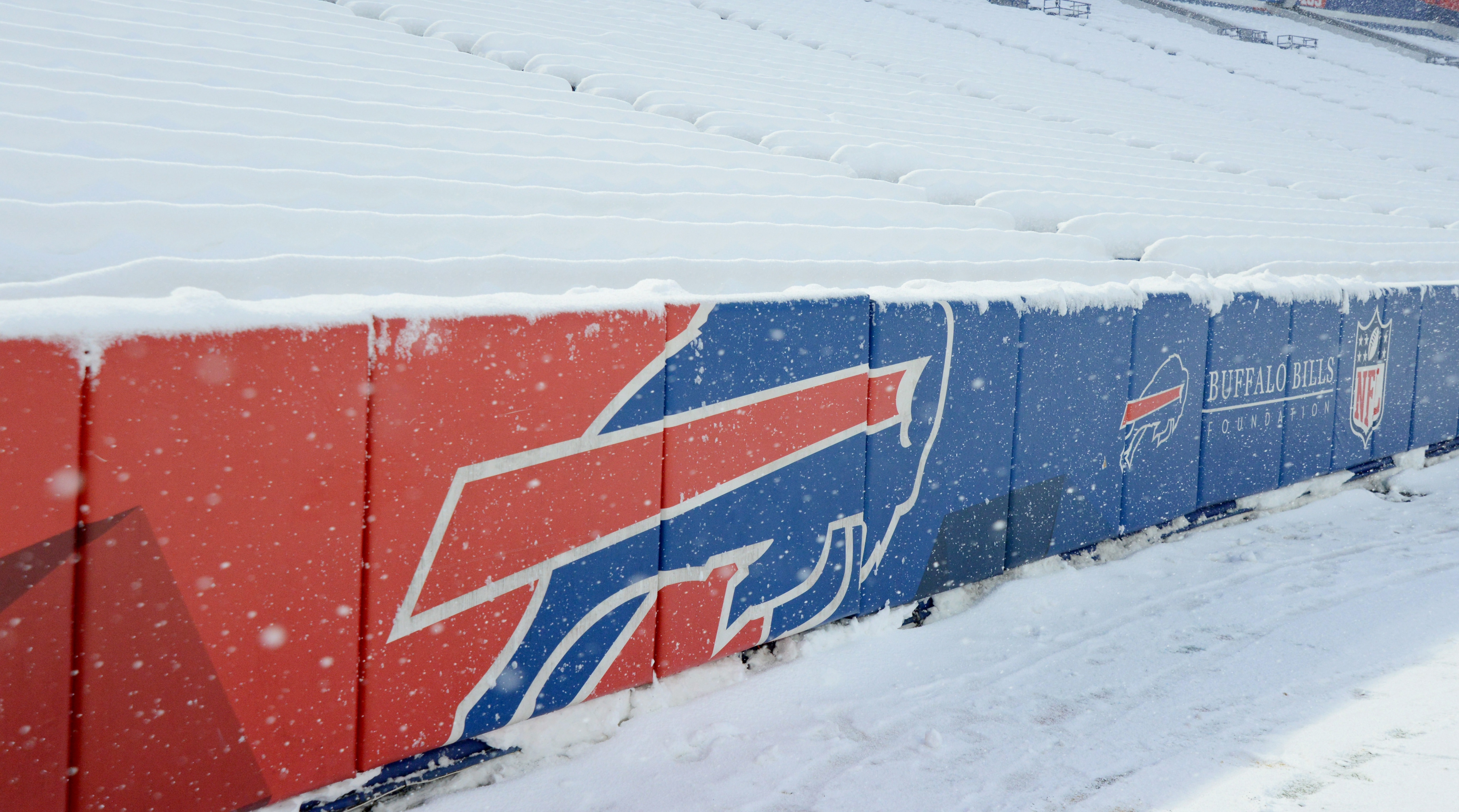 Buffalo Bills sign their name on the playoff bracket by snowing