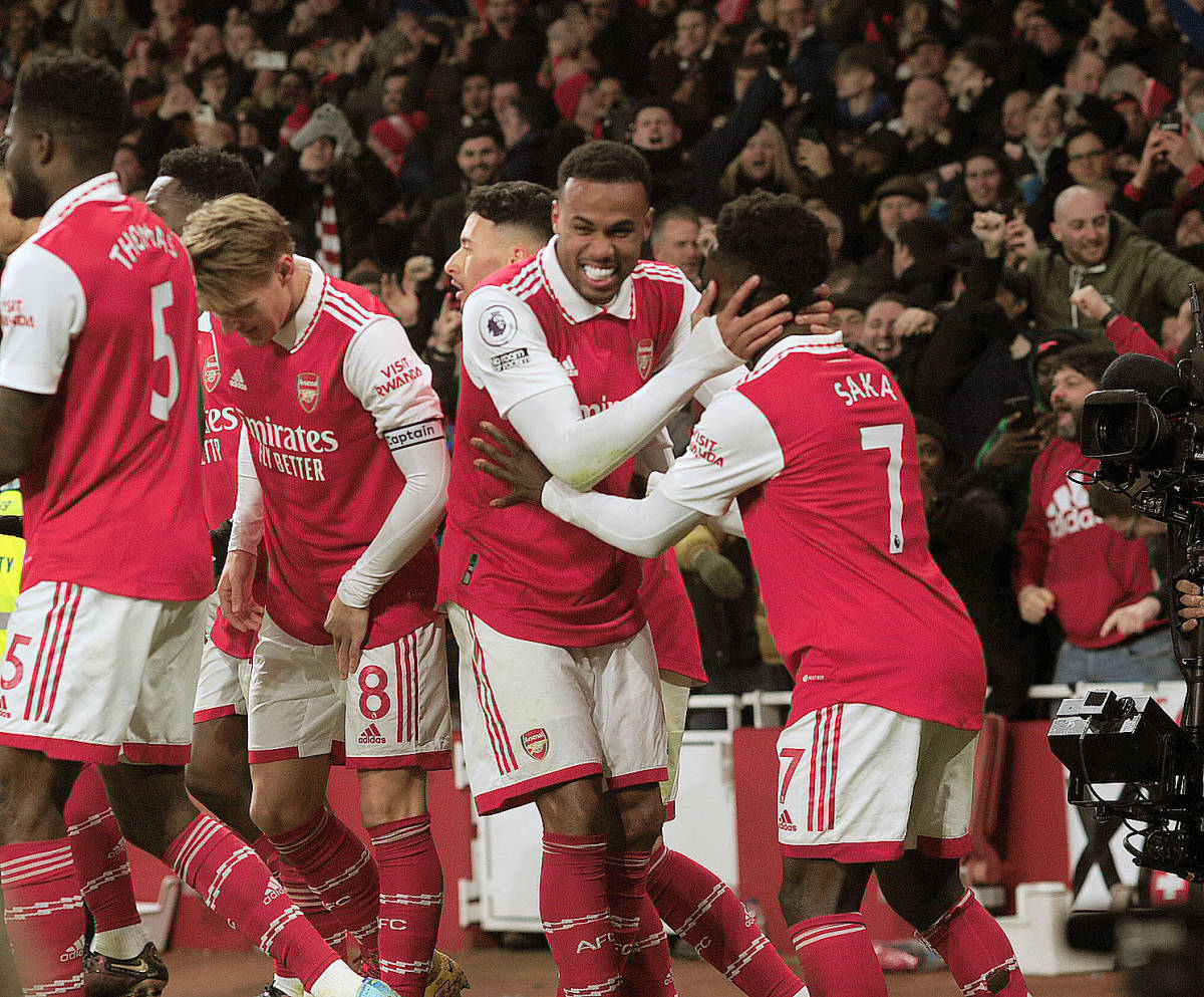 Arsenal's players pictured celebrating a goal by Bukayo Saka (right) during a 3-2 win over Manchester United in January 2023