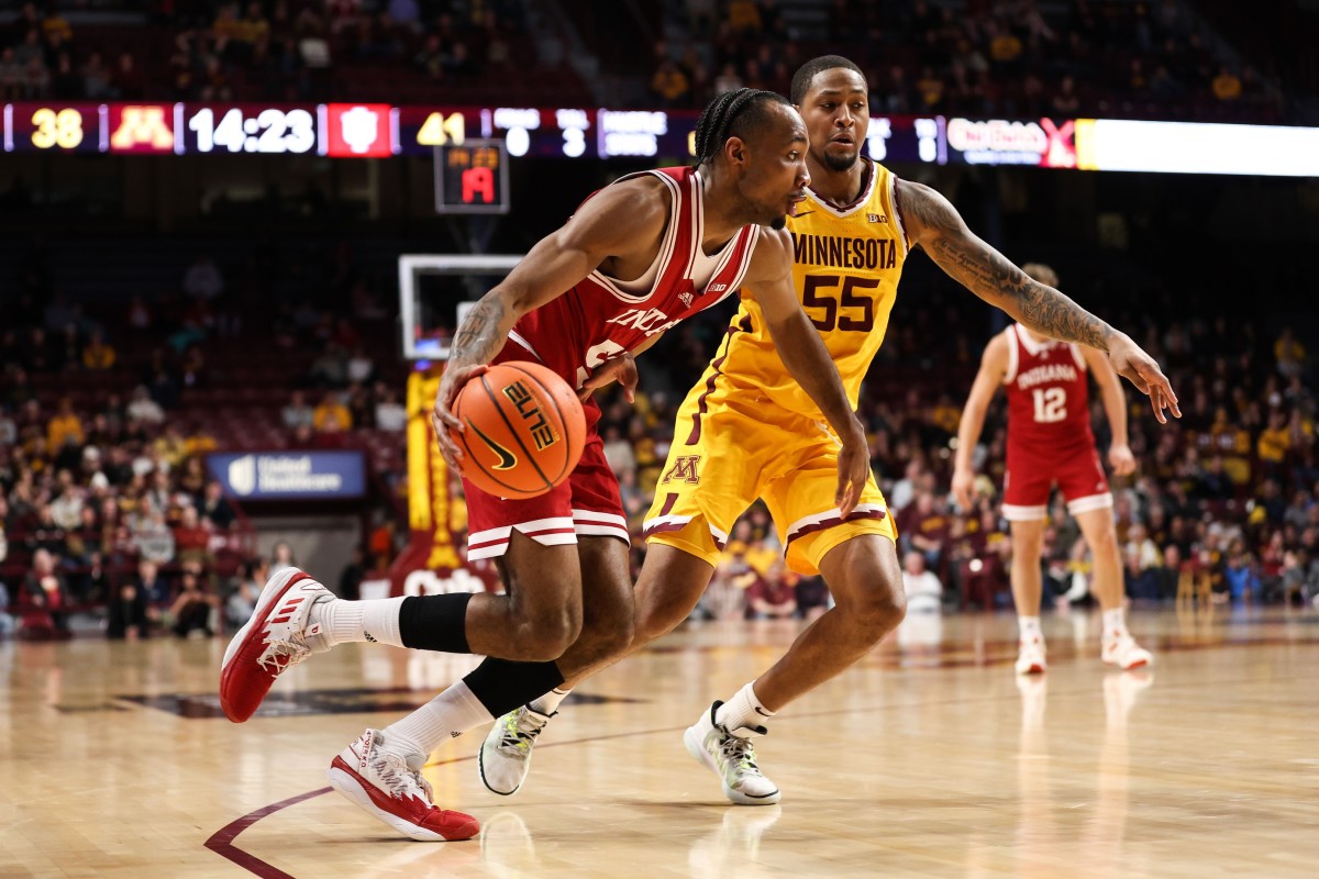 Indiana Hoosiers guard Tamar Bates (53) drives to the basket while Minnesota Golden Gophers guard Ta'lon Cooper (55) plays defense.