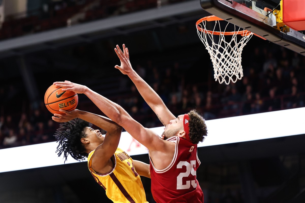 Indiana Hoosiers forward Race Thompson (25) blocks a shot by Minnesota Golden Gophers forward Jaden Henley (24) during the first half at Williams Arena.