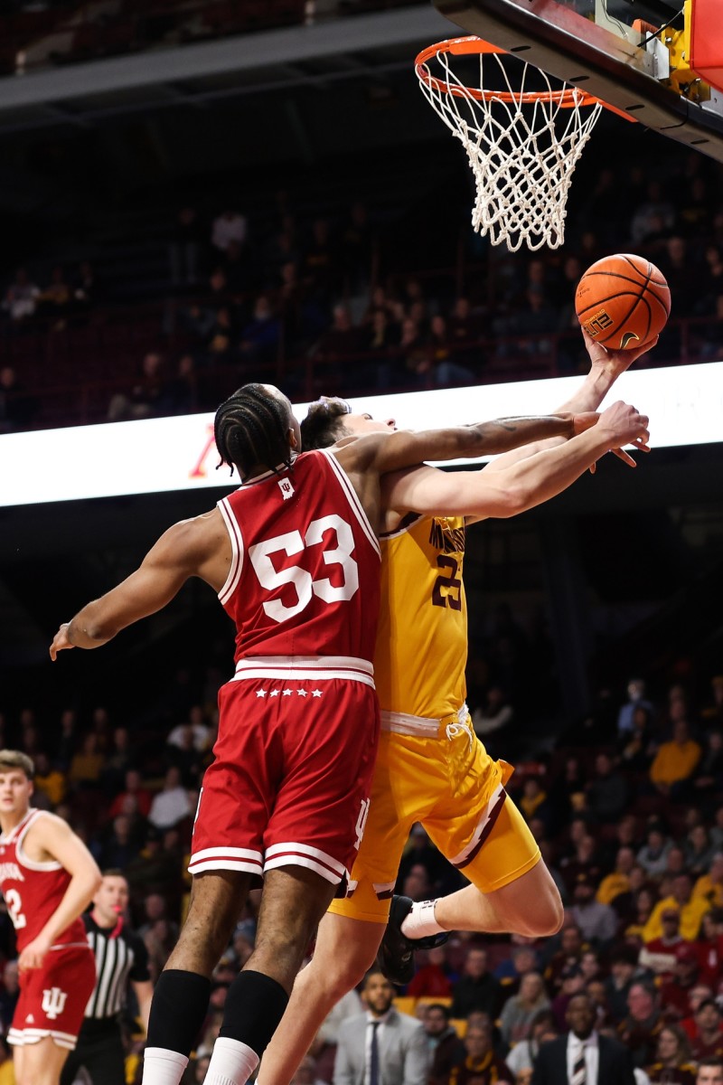 Minnesota Golden Gophers guard Will Ramberg (25) is fouled by Indiana Hoosiers guard Tamar Bates (53) during the first half at Williams Arena.