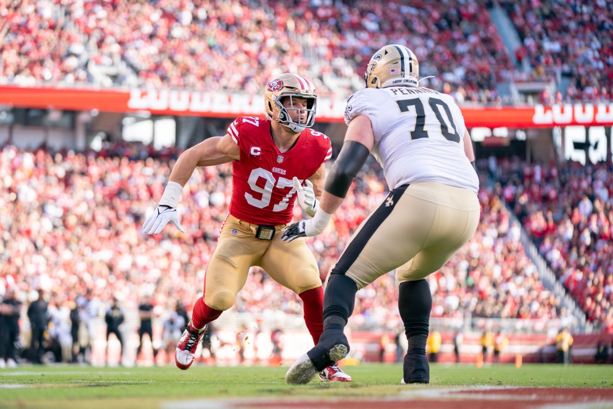 November 27, 2022; San Francisco 49ers defensive end Nick Bosa (97) rushes against New Orleans Saints tackle Trevor Penning (70). Mandatory Credit: Kyle Terada-USA TODAY Sports