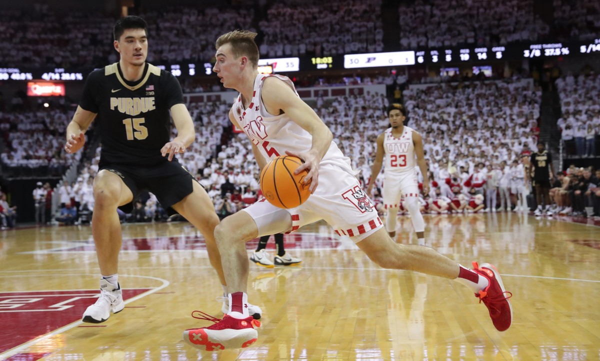 Wisconsin forward Tyler Wahl (5) drives past Purdue center Zach Edey (15) along the baseline during the second half of their game Tuesday, March 1, 2022, at the Kohl Center in Madison, Wis. Wisconsin beat Purdue 70-67 to win the Big Ten Championship.