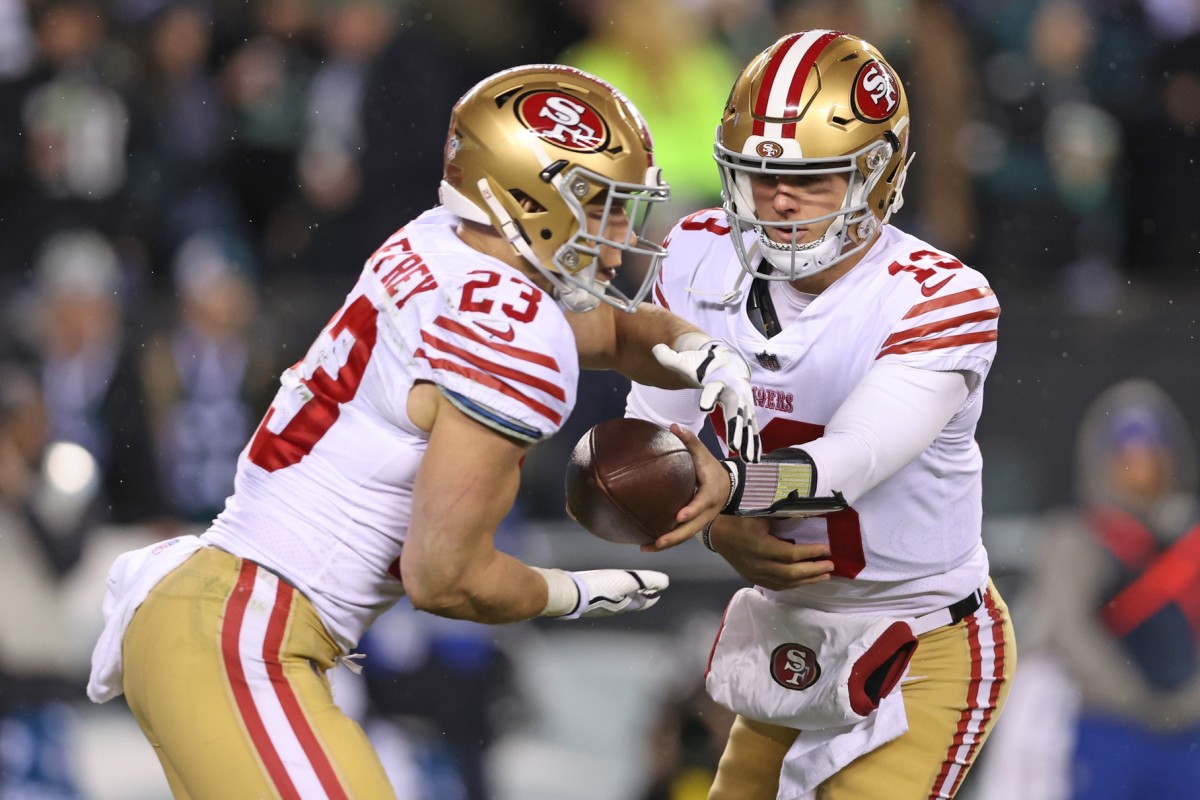 Brock Purdy y Christian McCaffrey