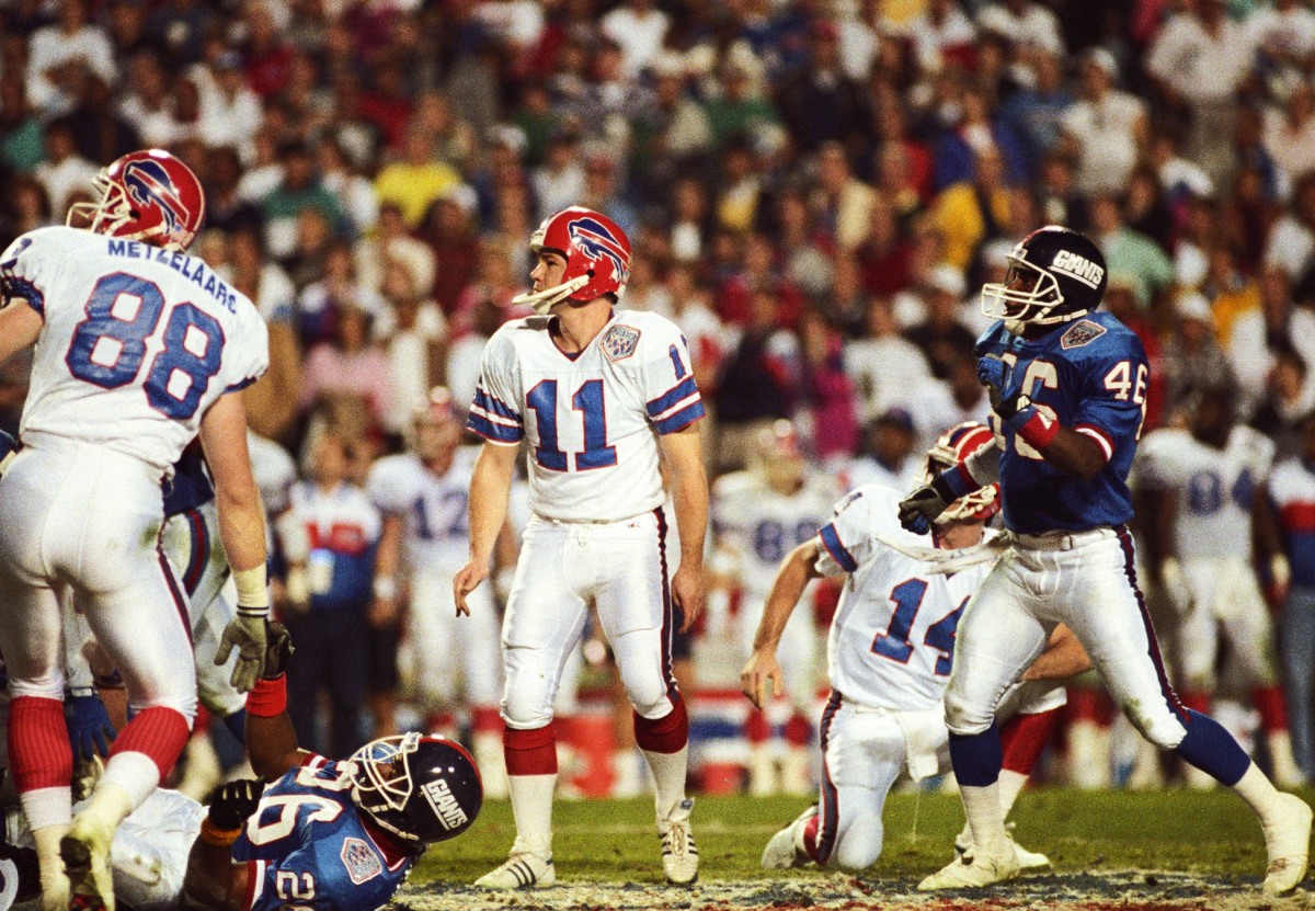 Jan 27, 1991; Tampa, FL, USA; FILE PHOTO; Buffalo Bills kicker Scott Norwood (11) after attempting a field goal under the hold of quarterback Frank Reich (14) against the New York Giants during Super Bowl XXV at Tampa Stadium. The Giants defeated the Bills 19-20.