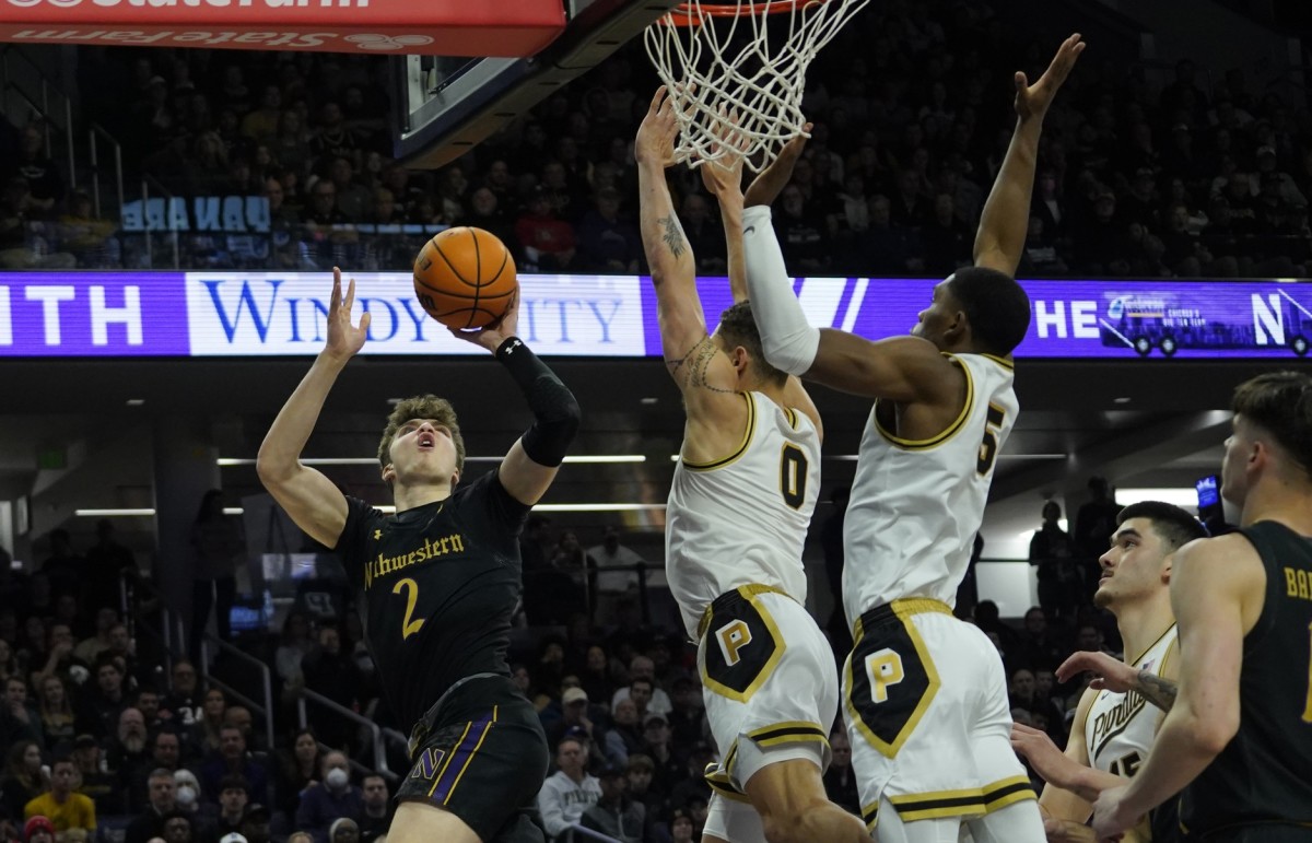 Mason Gillis and Brandon Newman block at Northwestern