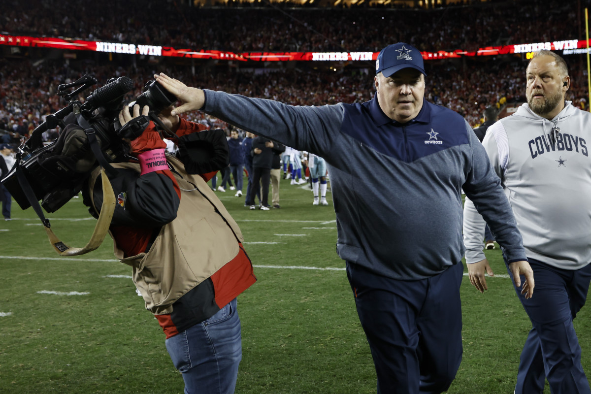 Dallas Cowboys coach Mike McCarthy pushes a cameraman after losing to the San Francisco 49ers.