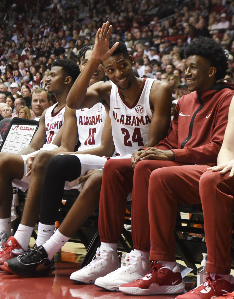 Alabama Crimson Tide forward Brandon Miller (24) waves at Alabama Crimson Tide football coach Nick Saban (not pictured) after coming out of the game against the Georgia Bulldogs at Coleman Coliseum.