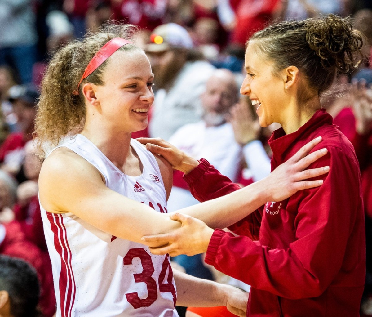 Indiana's Grace Berger (34) is welcomed off the floor by Team and Recruitment Coordinator Ali Patberg during the second half of the Indiana versus Purdue women's basketball game at Simon Skjodt Assembly Hall on Sunday, Feb. 19, 2023.