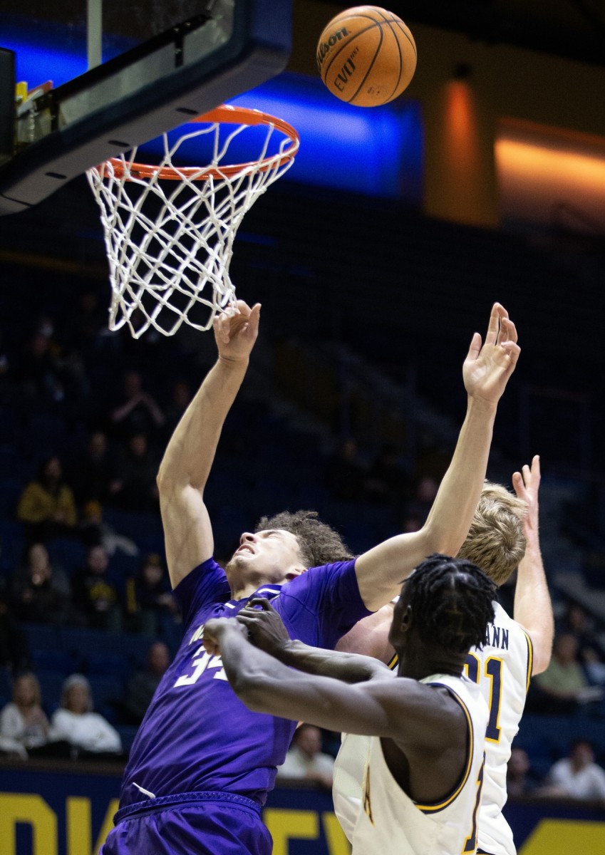 In a battle of 7-footers, the UW's Braxton Meah and Cal's Lars Thiemann get after it inside.