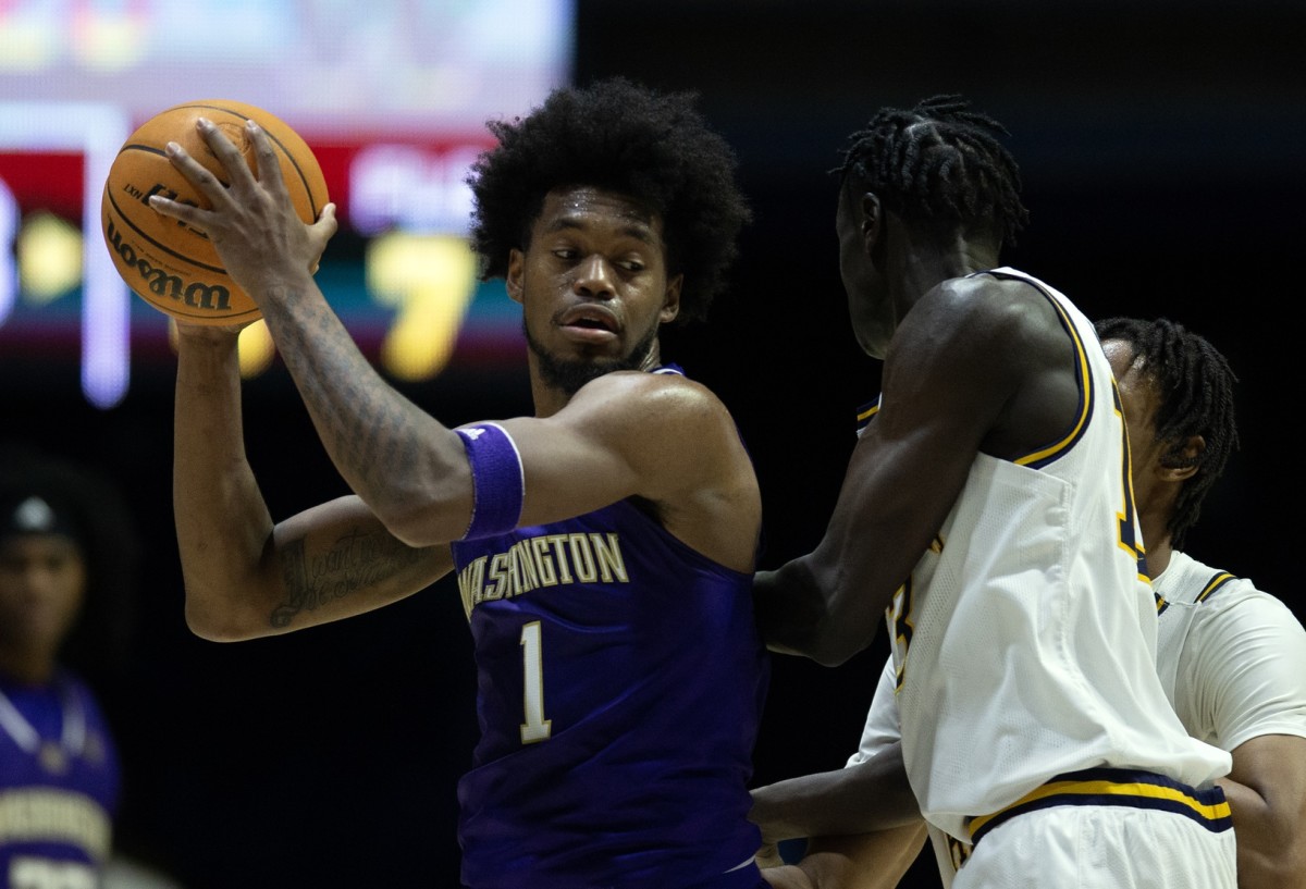 Keion Brooks looks for an opening in Thursday night's game at Cal.