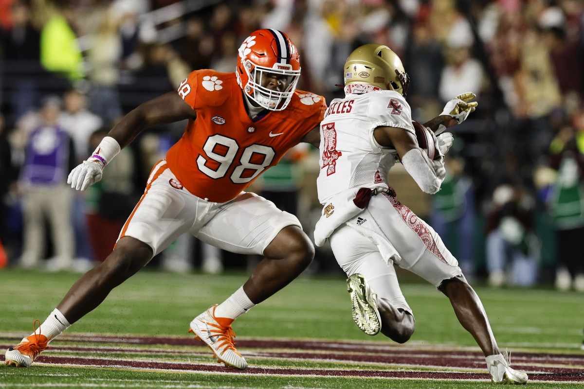 Oct 8, 2022; Chestnut Hill, Massachusetts, USA; Clemson Tigers defensive end Myles Murphy (98) moves to bring down Boston College Eagles wide receiver Zay Flowers (4) during the second half at Alumni Stadium.