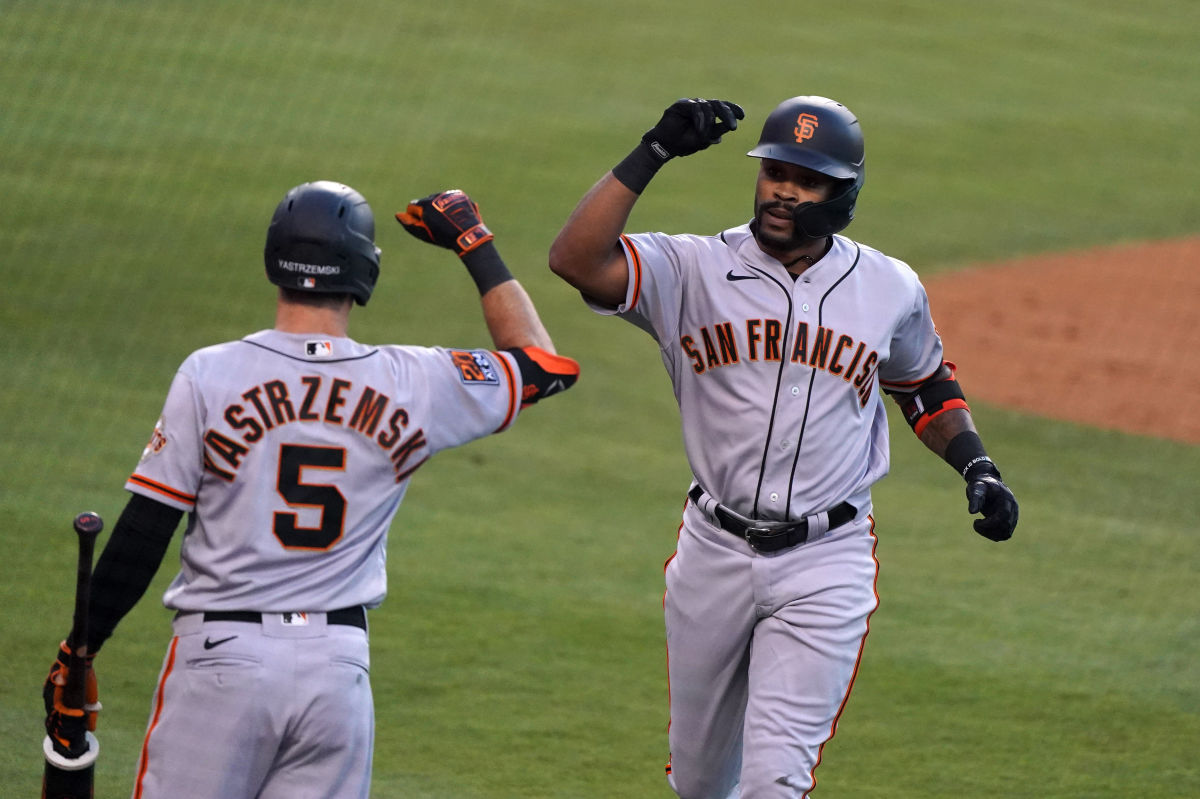 SF Giants outfielder Jaylin Davis celebrates with Mike Yastrzemski. (2020)